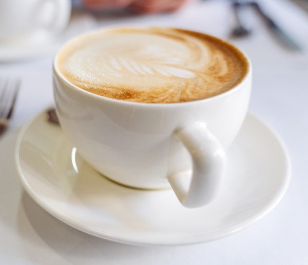 white cup of coffee on the table in a coffee shop 2022 10 25 22 41 56 utc